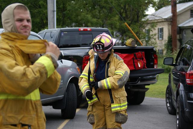 Keegan Muldowney dons PPE preparing for vehicle fire training in Keeseville NY 8/21/2010